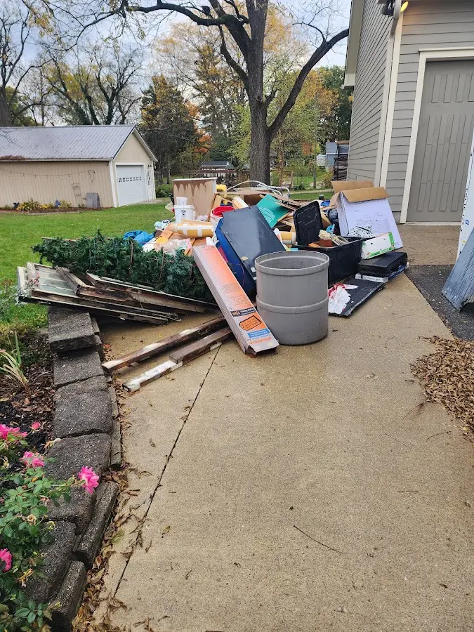 Dumpster being loaded with debris for Commercial Dumpster Rental in Snyder